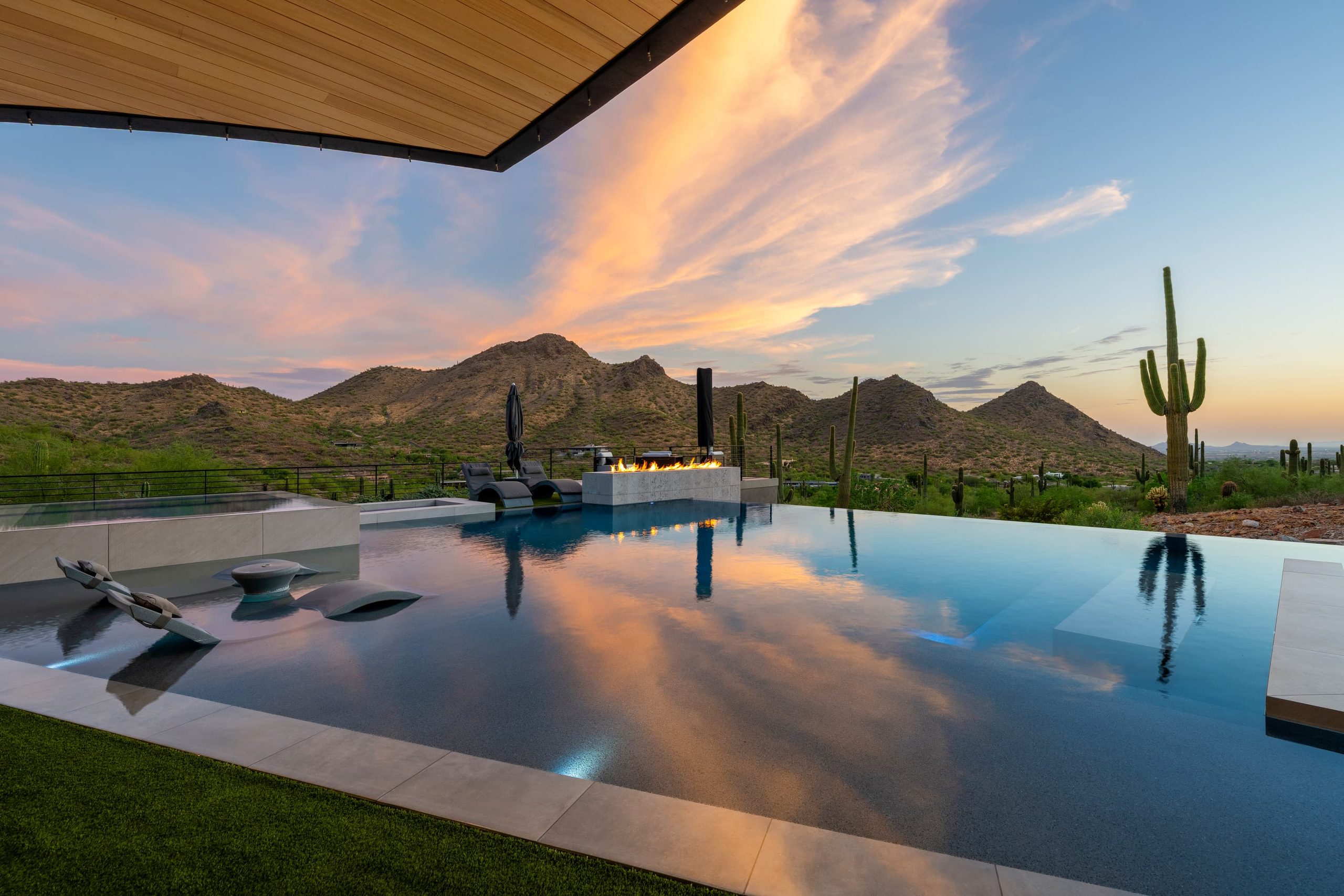 Murry residence — vanishing-edge pool on a desert hillside at sunset