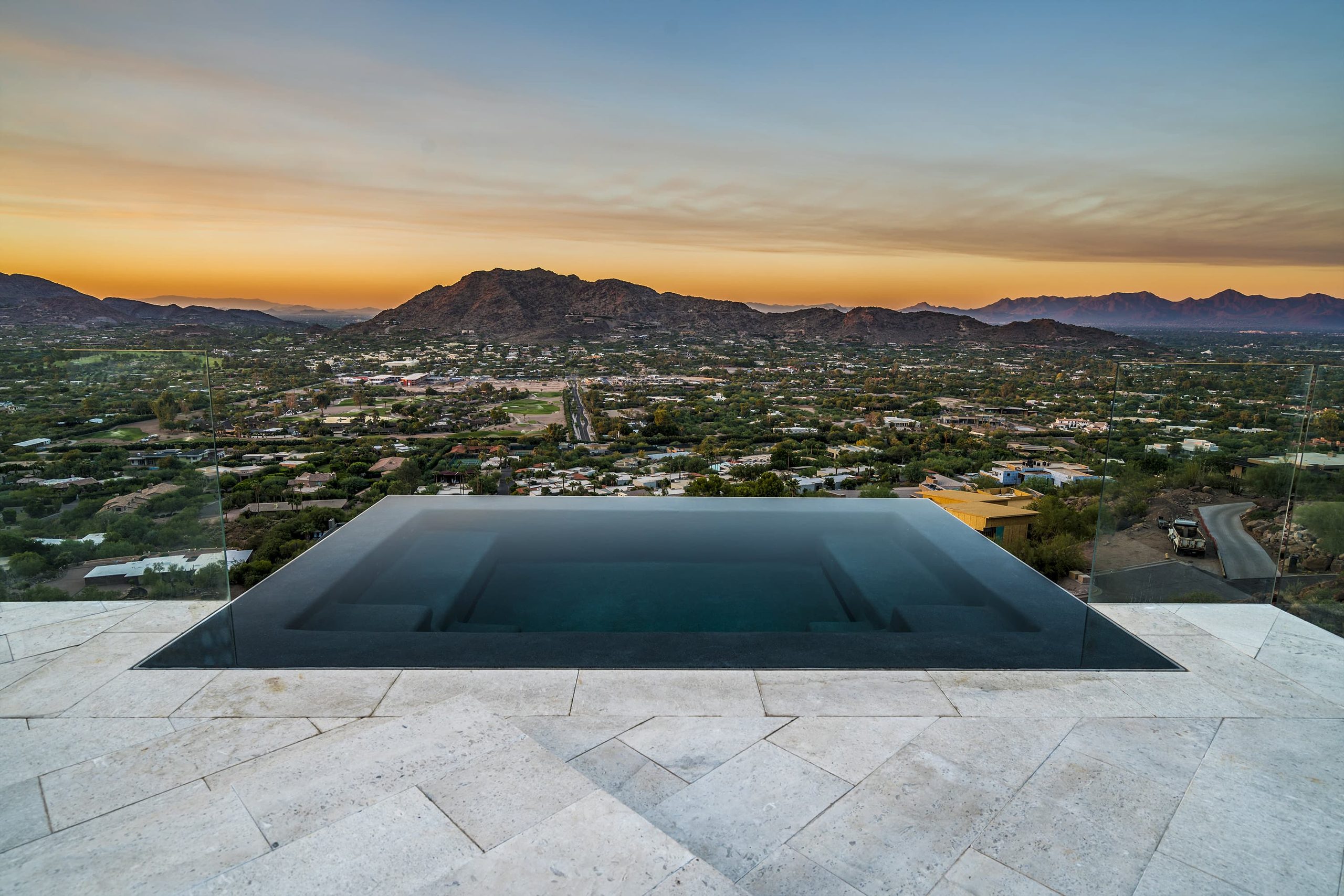 Vanishing-edge pool overlooking the Phoenix valley at sunset